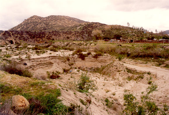 View of Tecate Creek downstream of railroad-crossing embankment near Tecate, Baja California, Mexico