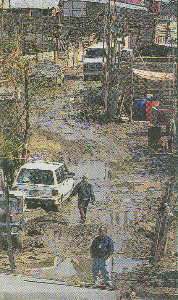 View of street in Arroyo Alamar neighborhood during flood of February 24, 2004. 