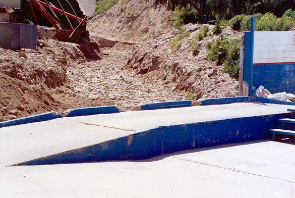Construction across the stream at Arroyo Aguaje de la Tuna, Tijuana, Baja California, Mexico 